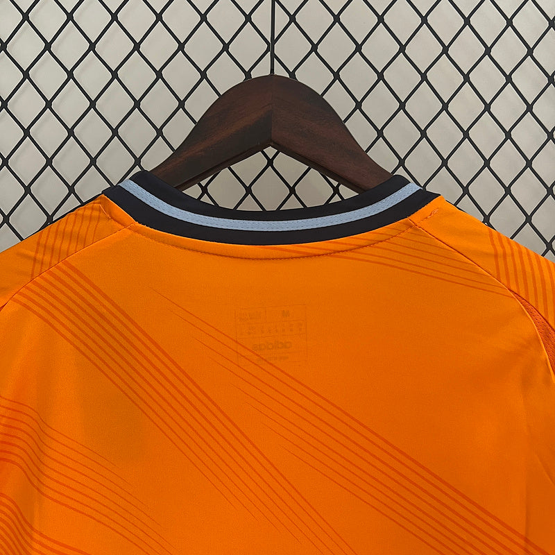 24-25 Real Madrid away orange soccer jersey