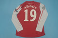 11-12 Arsenal home UCL fonts