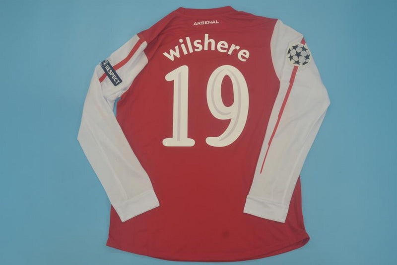 11-12 Arsenal home UCL fonts
