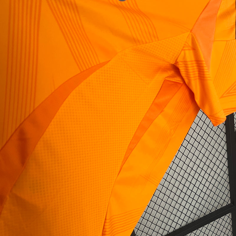 24-25 Real Madrid away orange soccer jersey